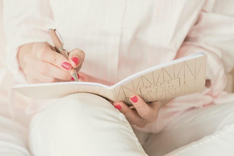 A woman writing in a journal