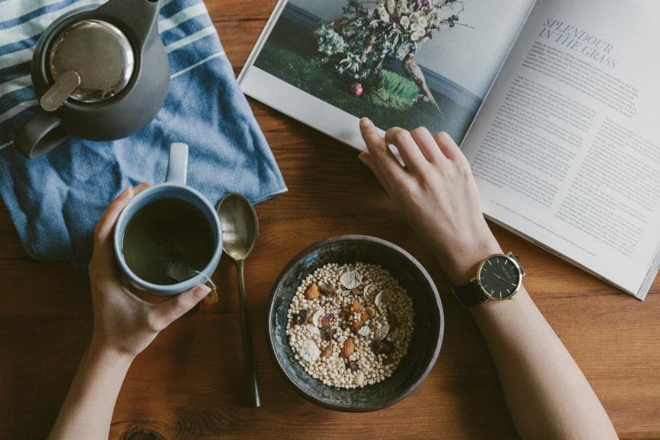 Tea and reading at a wooden table